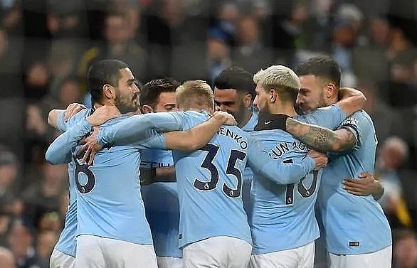 Sterling hat trick takes City four clear