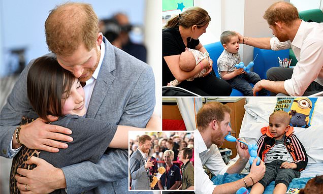 He’s a natural! New father Prince Harry comforts young patients at Oxford Children’s Hospital and reveals he ‘can’t imagine life’ without Archie – but admits the baby kept him up last night