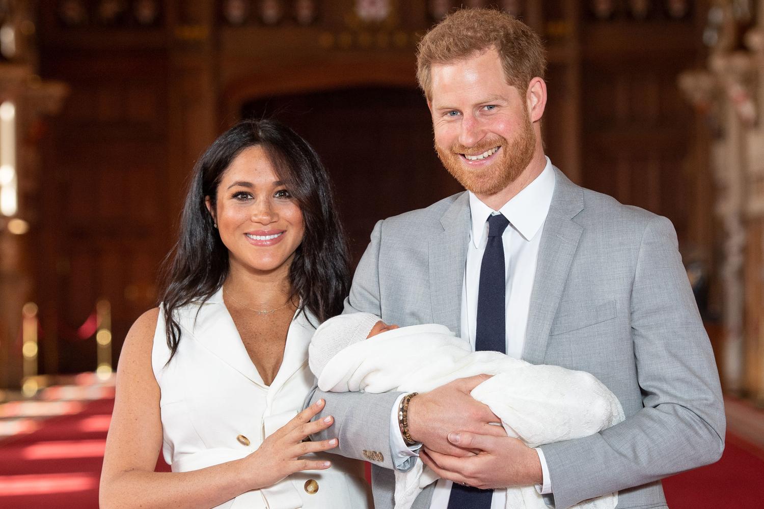 Meghan Markle looks radiant in white for photocall with baby son