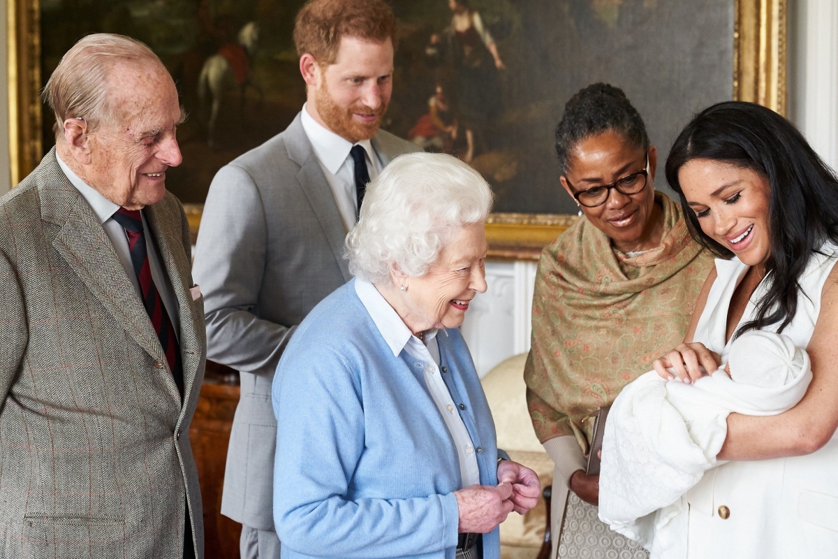 Queen beams as Meghan Markle shows her royal baby Archie Harrison with mum Doria Ragland and Prince Harry looking on