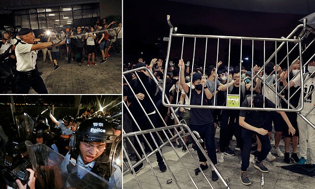 Hong Kong riot police using batons, tear gas and pepper spray clash with protesters after million-strong demo over proposed new extradition bill with China