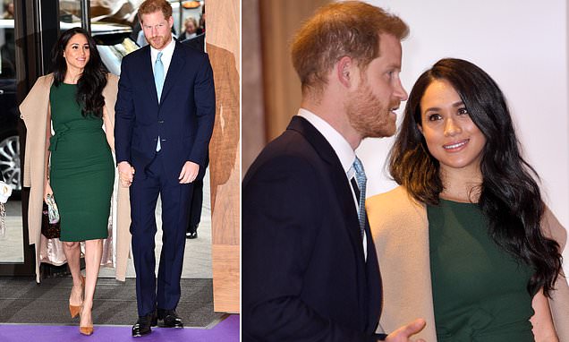 Recycling royal! Meghan Markle re-wears her engagement dress and coat she wore to Sandringham at Christmas as she arrives hand-in-hand with Prince Harry for the WellChild Awards